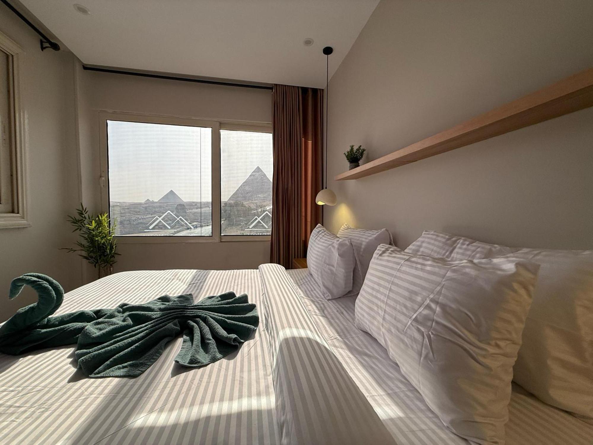The Gate Hotel Front Pyramids & Sphinx View Kafrat al Jabal Exterior photo